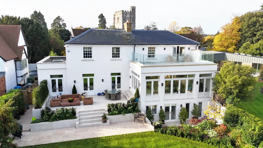 A construction project in Oxfordshire by Blenford. It is a pristine white house that looks great in the sunlight.